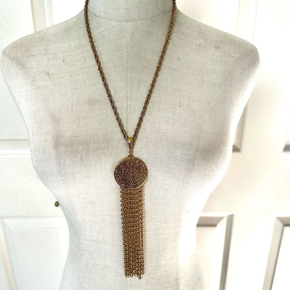 Gold tone long tassel necklace